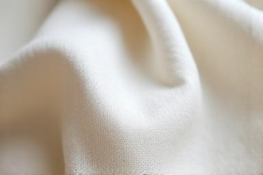 Lähikuva luomupellavasta, luonnollinen, tekstuurinen kangas